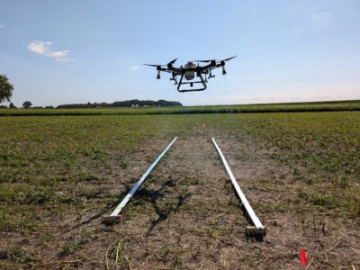 Spray drone swath and spray coverage testing. (Photo credit: Tommy Butts, Purdue University)