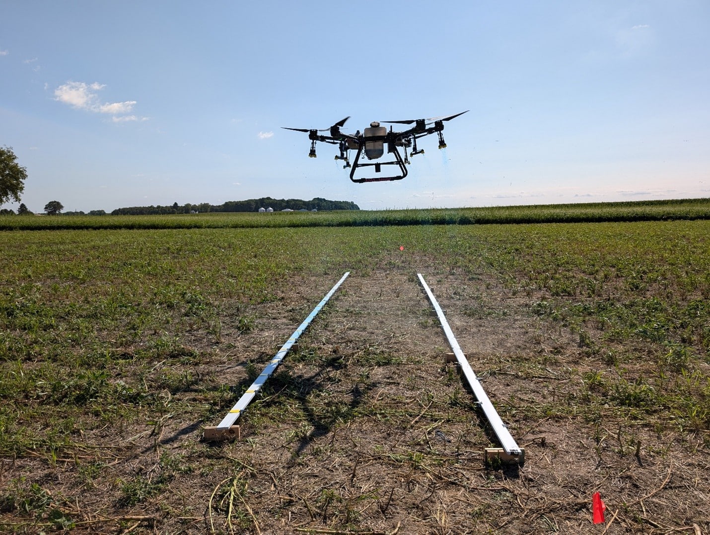 Spray drone swath and spray coverage testing. (Photo credit: Tommy Butts, Purdue University)